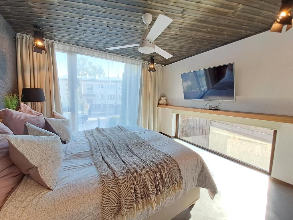 Säng eller sängar i ett rum på LUX Apartment