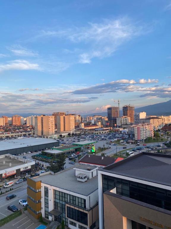 a view of a city with buildings and cars at City Center 2bedroom in Ferizaj