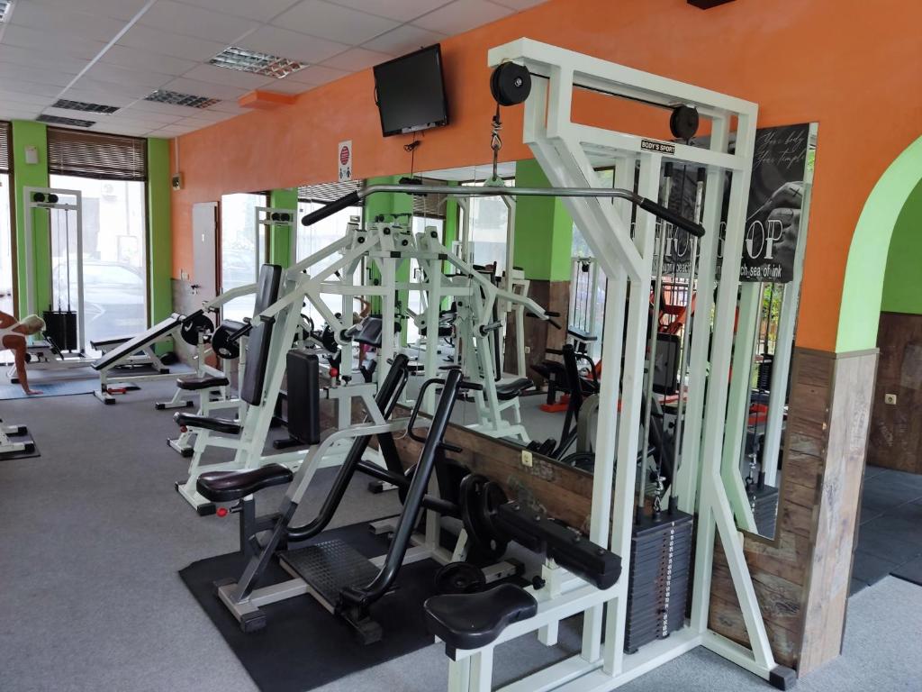 a gym with treadmills and ellipticals at Charis Cozy Family apart at Sun Village Complex close to the Beach in Sunny Beach