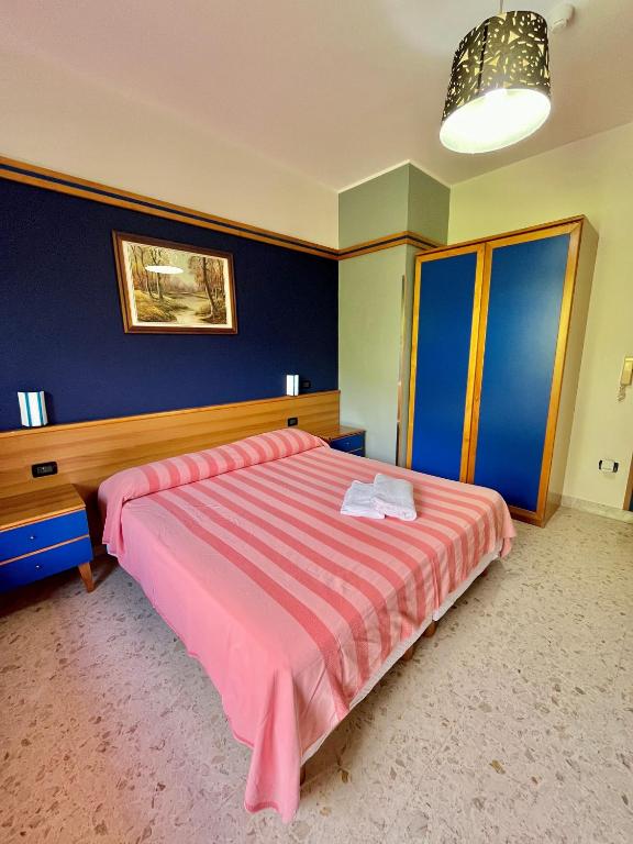 Postel nebo postele na pokoji v ubytování Hotel Praja