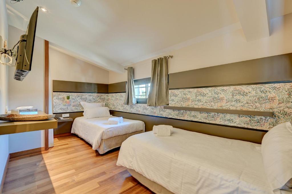 Postel nebo postele na pokoji v ubytování Hôtel Bor
