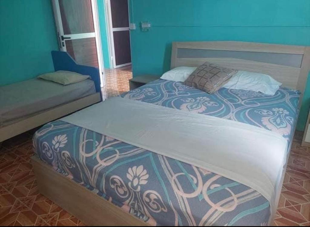 Postel nebo postele na pokoji v ubytování Tilapasse resto & guest house