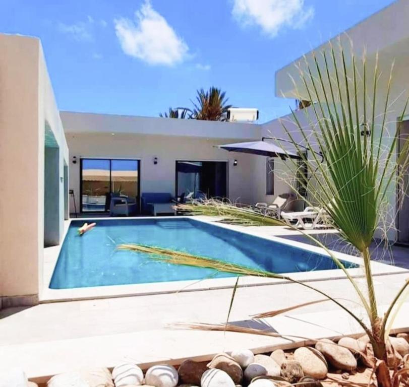 Bazén v ubytování villa arij Djerba nebo v jeho okolí