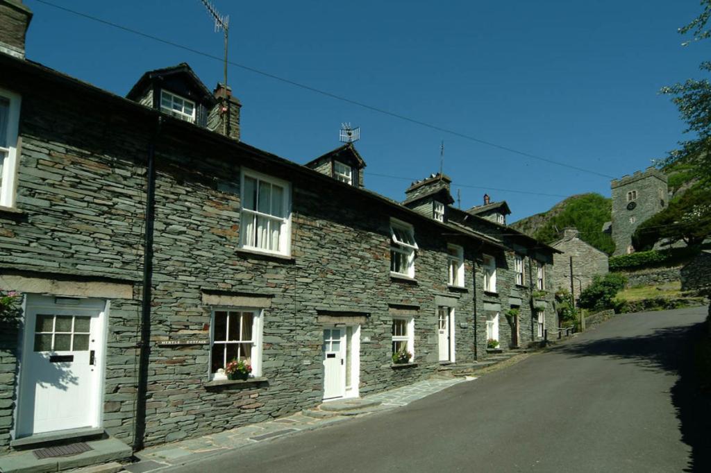 a row of stone houses on a street at Myrtle Cottage in Chapel Stile