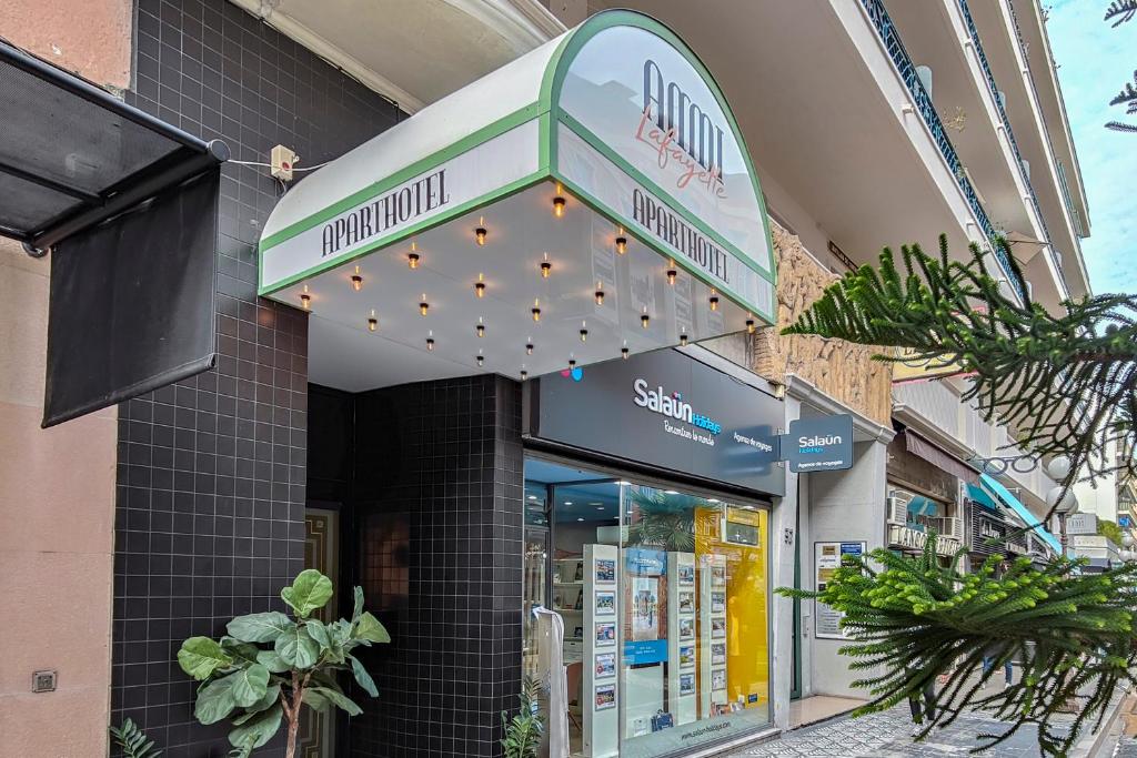 a store front with a sign for a pharmacy at Aparthotel AMMI Nice Lafayette in Nice