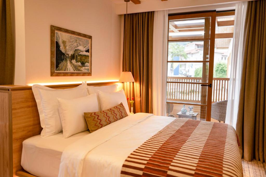 Postel nebo postele na pokoji v ubytování Hotel Baškuća Sarajevo