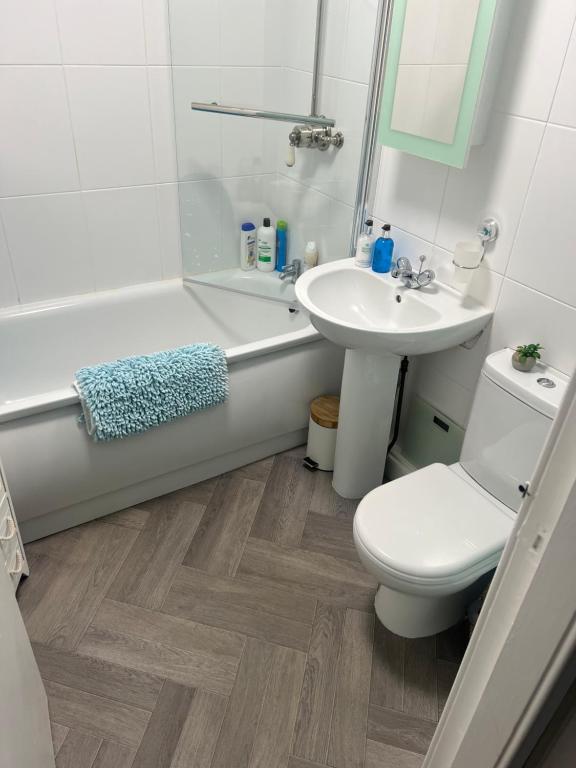 a bathroom with a sink and a toilet and a bath tub at Teviot View Holiday Let’s Hawick in Hawick