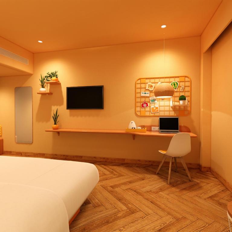 TV a/nebo společenská místnost v ubytování Bloom Hotel - Golf Course Road, Sector 43