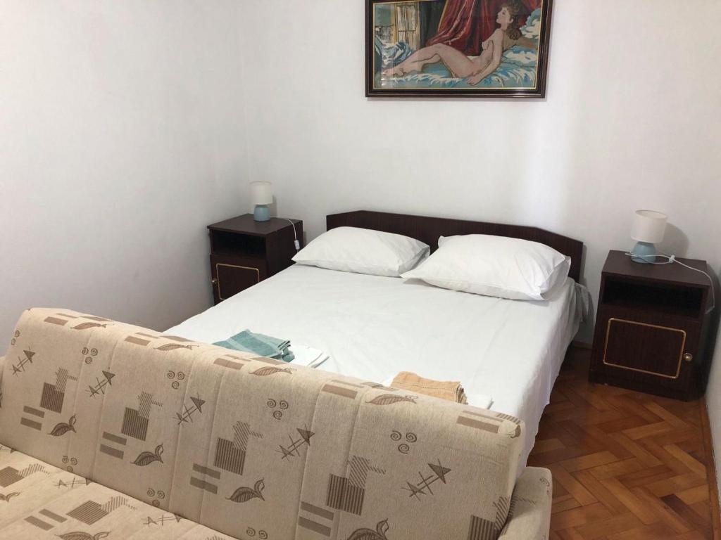 Posteľ alebo postele v izbe v ubytovaní Vuke Apartments