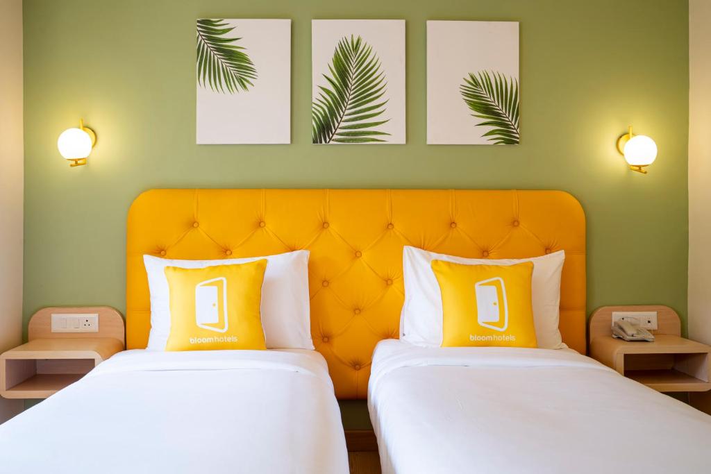 Postel nebo postele na pokoji v ubytování Bloom Hotel - Sector 19
