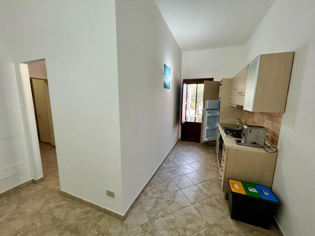 Kuchyň nebo kuchyňský kout v ubytování L'oasi Una Pineta Sul Mare
