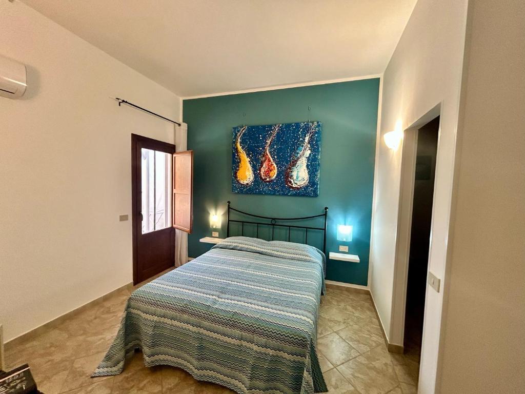 Postel nebo postele na pokoji v ubytování L'oasi Una Pineta Sul Mare