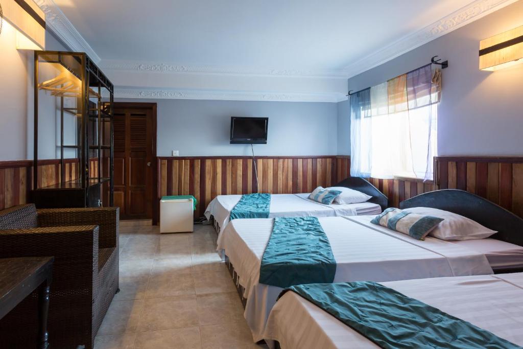Postel nebo postele na pokoji v ubytování Le Tigre Villa