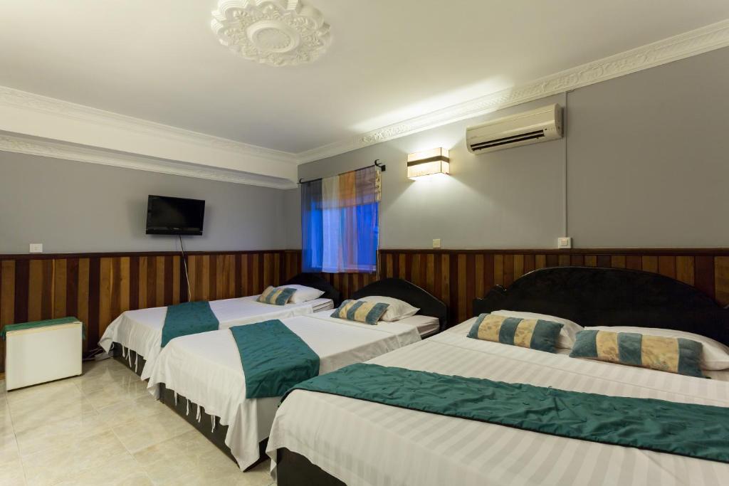 Postel nebo postele na pokoji v ubytování Le Tigre Villa