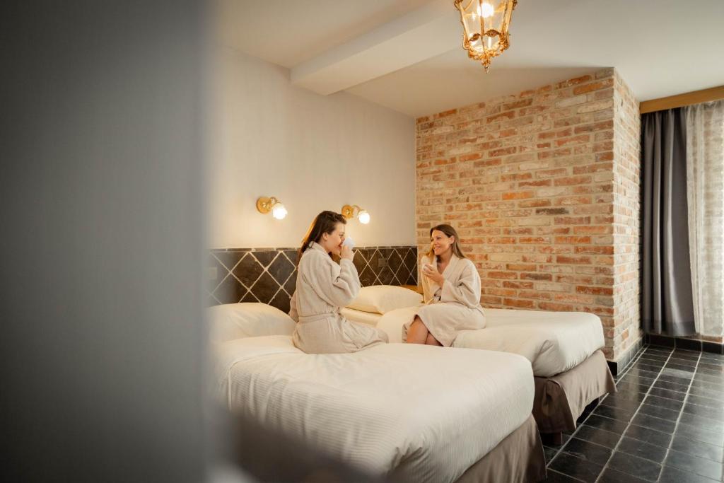 Postel nebo postele na pokoji v ubytování Thermae Boetfort Hotel