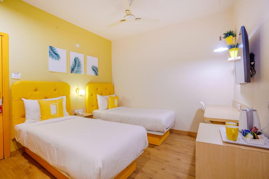 Postel nebo postele na pokoji v ubytování Bloom Hotel - GK2