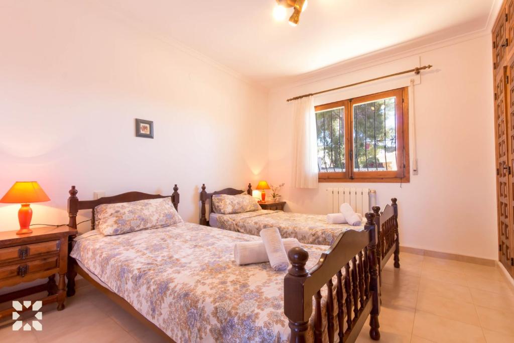 Postel nebo postele na pokoji v ubytování Villa Kelly 12 by Abahana Villas