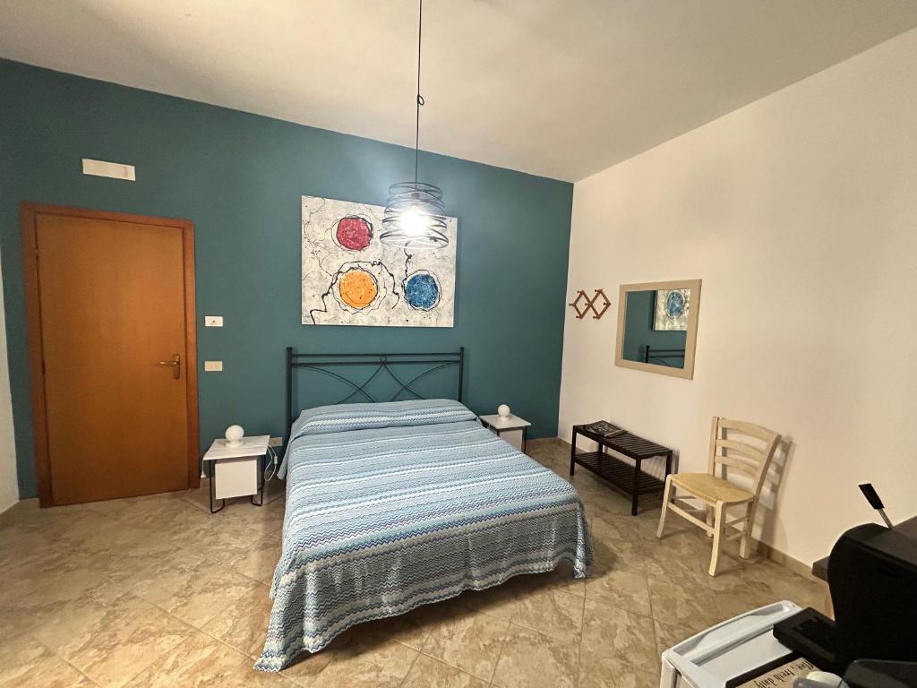 Postel nebo postele na pokoji v ubytování L'oasi Una Pineta Sul Mare
