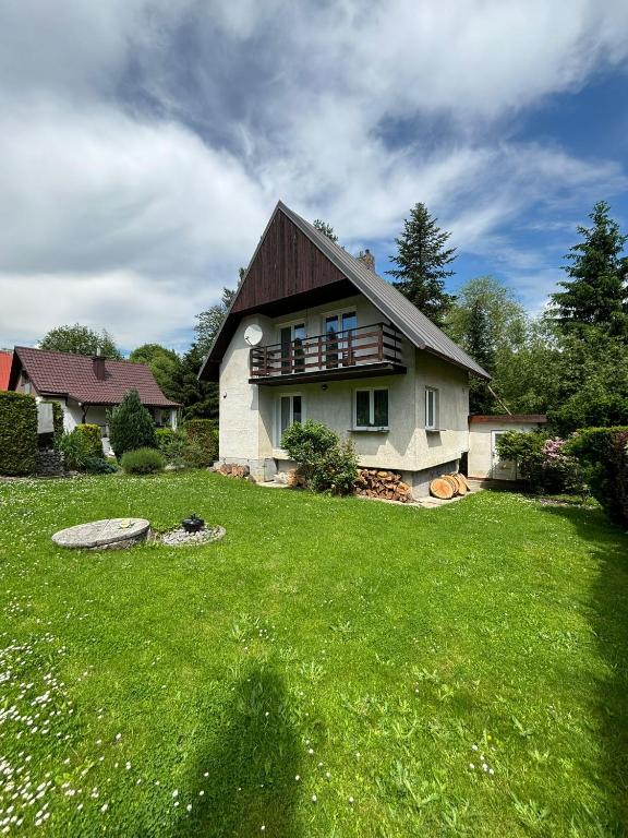 a house with a green lawn in front of it at Randy's House Plzeň in Pilsen