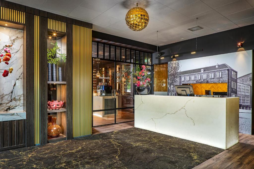 Lounge nebo bar v ubytování Hotel Restaurant Grandcafé 't Voorhuys