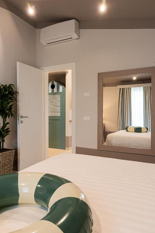 Postel nebo postele na pokoji v ubytování Hotel Estense