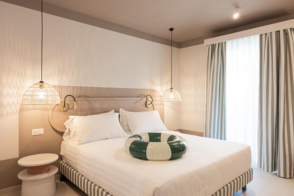 Postel nebo postele na pokoji v ubytování Hotel Estense