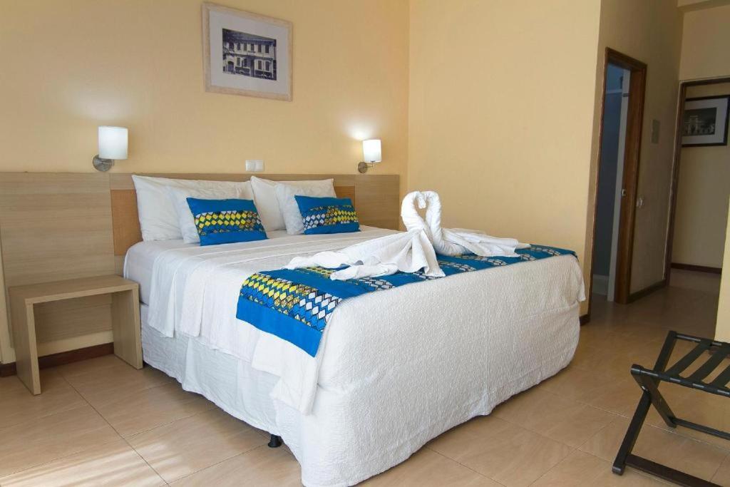 Postel nebo postele na pokoji v ubytování Hotel Santa Maria