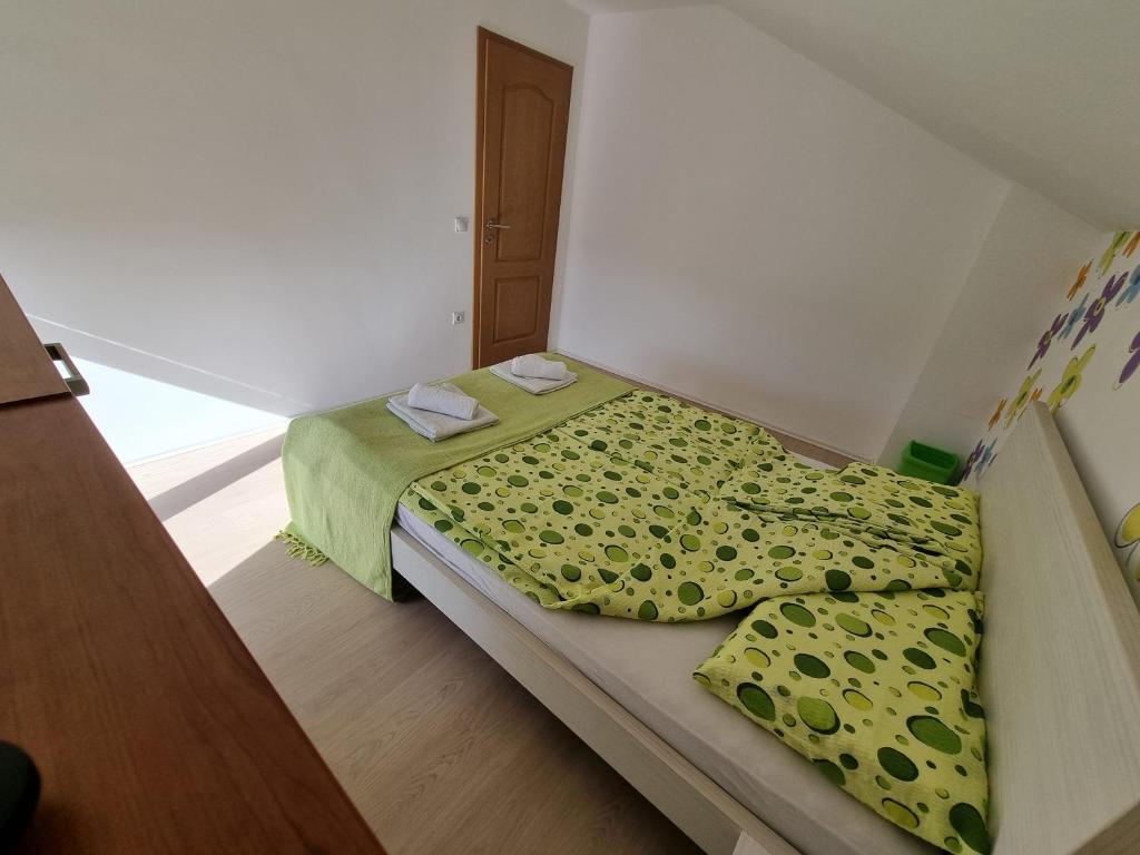 Postel nebo postele na pokoji v ubytování Vila MINJA