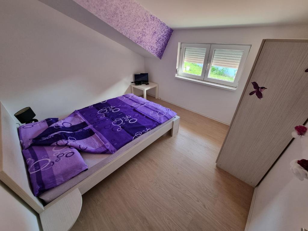 Postel nebo postele na pokoji v ubytování Vila MINJA