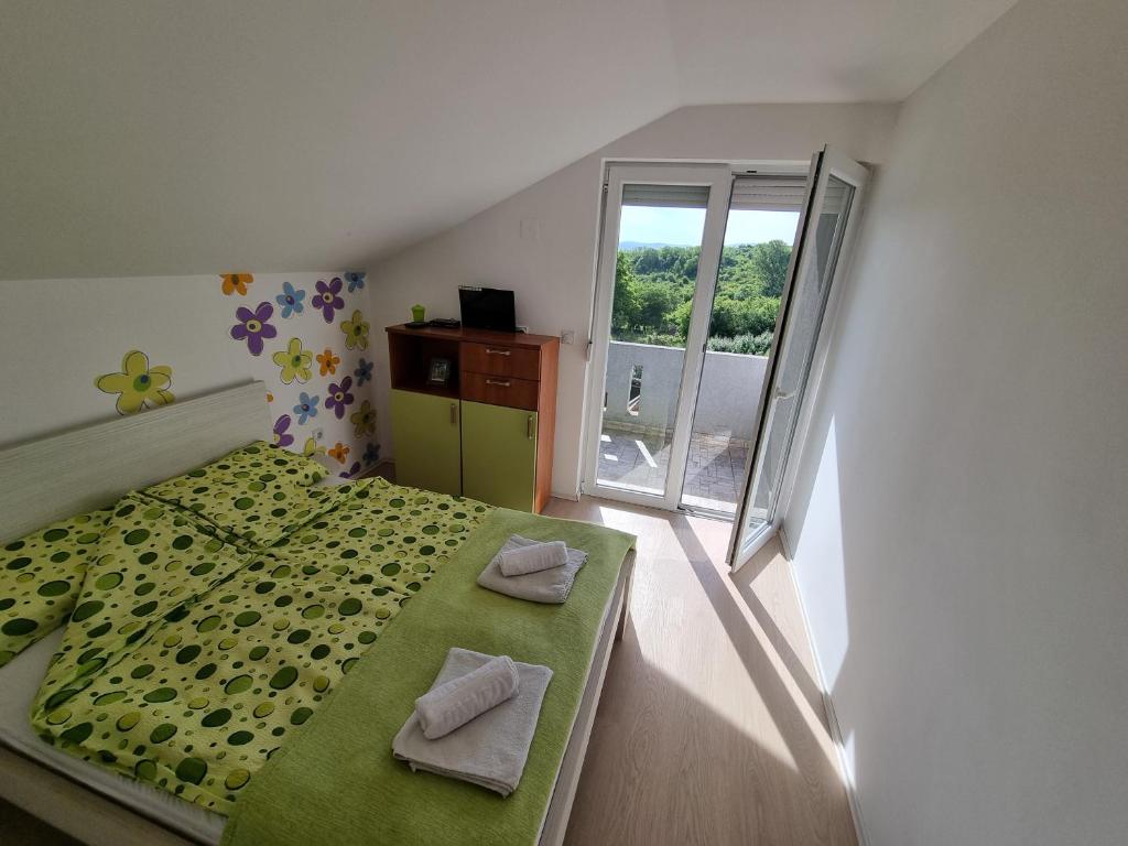 Postel nebo postele na pokoji v ubytování Vila MINJA