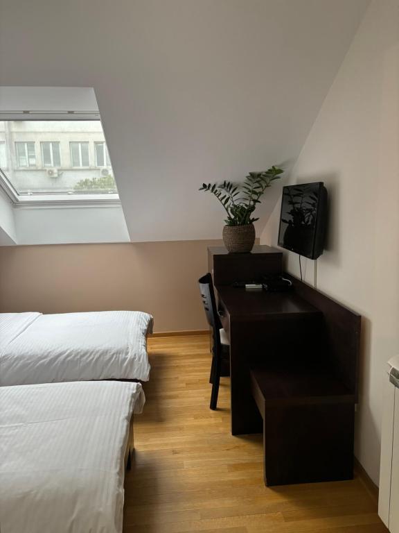Letto o letti in una camera di Atrium