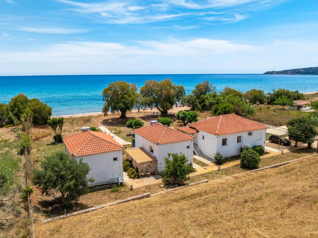 an aerial view of a house with the ocean in the background at Villa Voula in Koroni