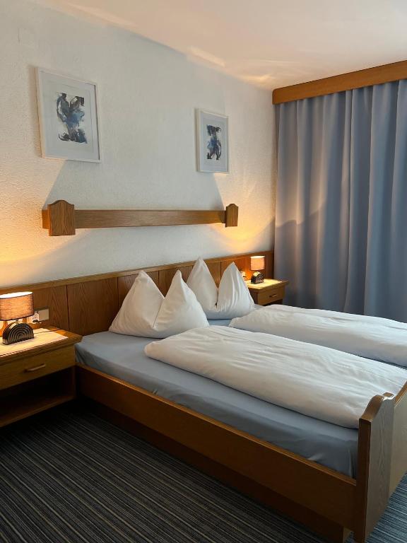 Postel nebo postele na pokoji v ubytování Frühstückspension-Appartementhaus Wasserer