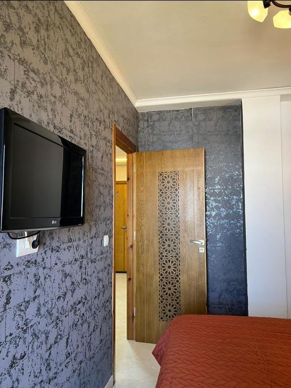 TV a/nebo společenská místnost v ubytování Charmant appartement bien situé.