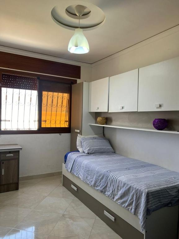 Postel nebo postele na pokoji v ubytování Charmant appartement bien situé.