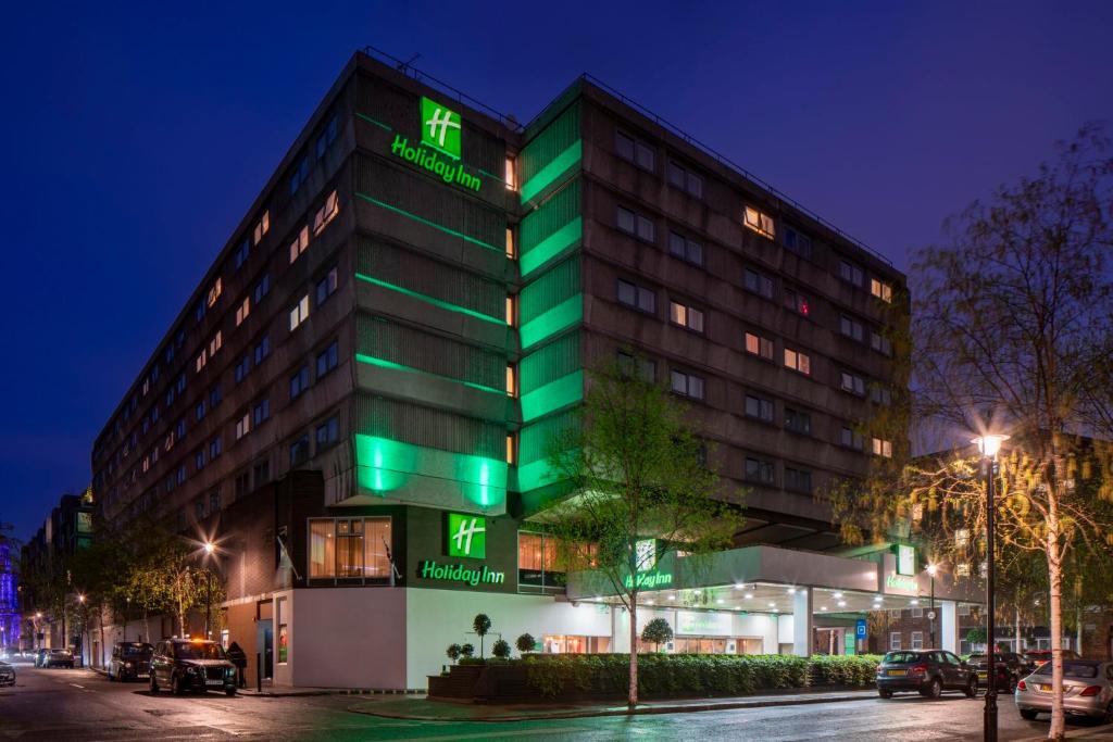 a building with green lights on the side of it at Holiday Inn London - Regent's Park by IHG in London