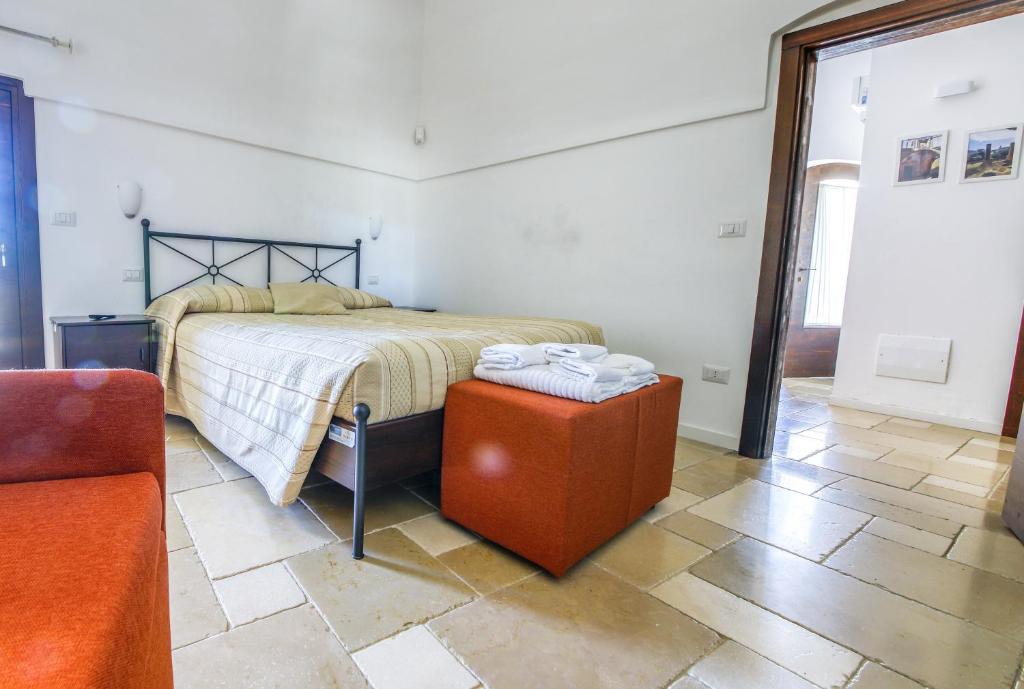 Łóżko lub łóżka w pokoju w obiekcie Il Melograno Apartments - Affitti Brevi Italia