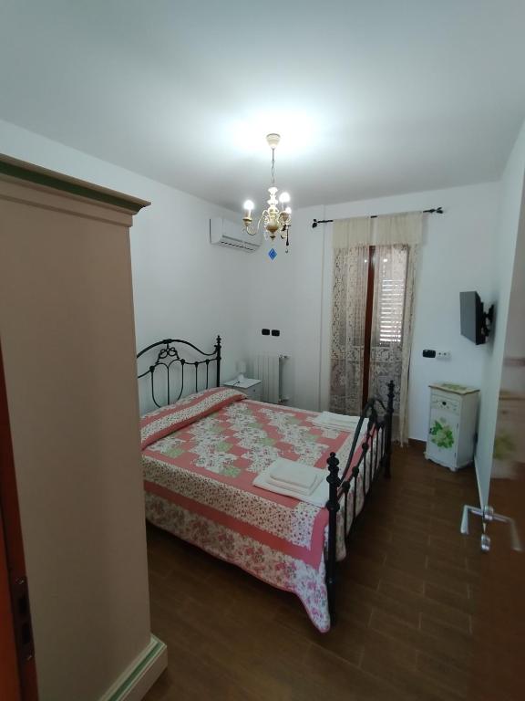 Łóżko lub łóżka w pokoju w obiekcie Casa di Lu’