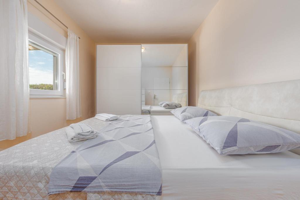 Postel nebo postele na pokoji v ubytování Villa Andu ZadarVillas