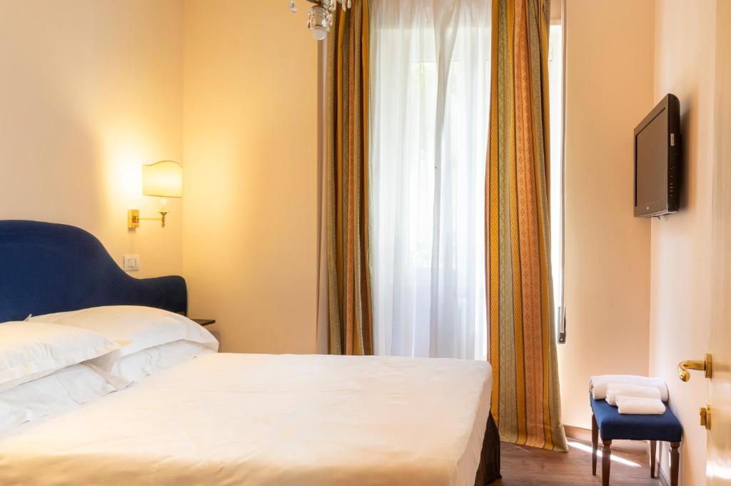 Postel nebo postele na pokoji v ubytování Boutique Hotel Heritage