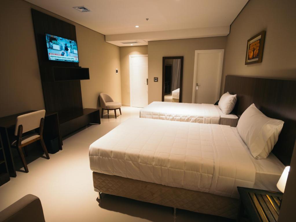 Postel nebo postele na pokoji v ubytování Zielo Hotel