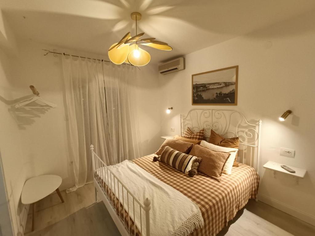 a bedroom with a bed and a ceiling fan at Casa Valsecca in Krk
