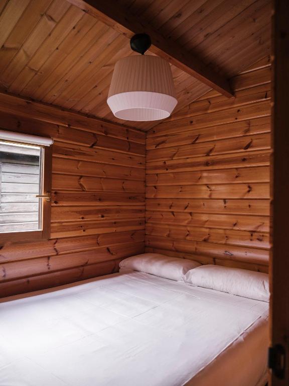 Cama o camas de una habitación en wecamp Cudillero
