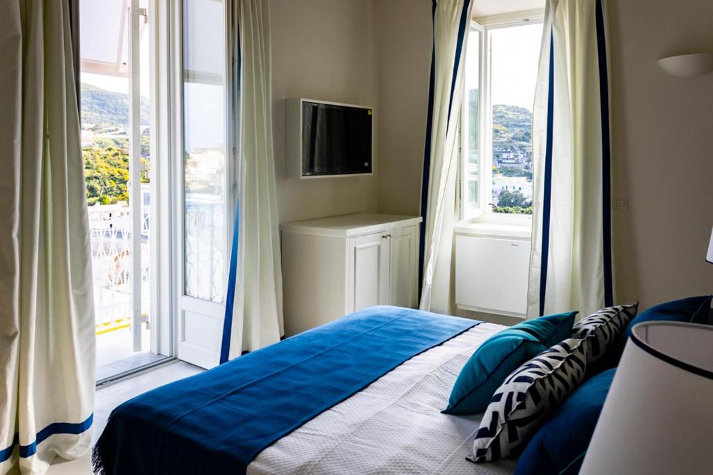 Postel nebo postele na pokoji v ubytování Il Palazzetto Ponza