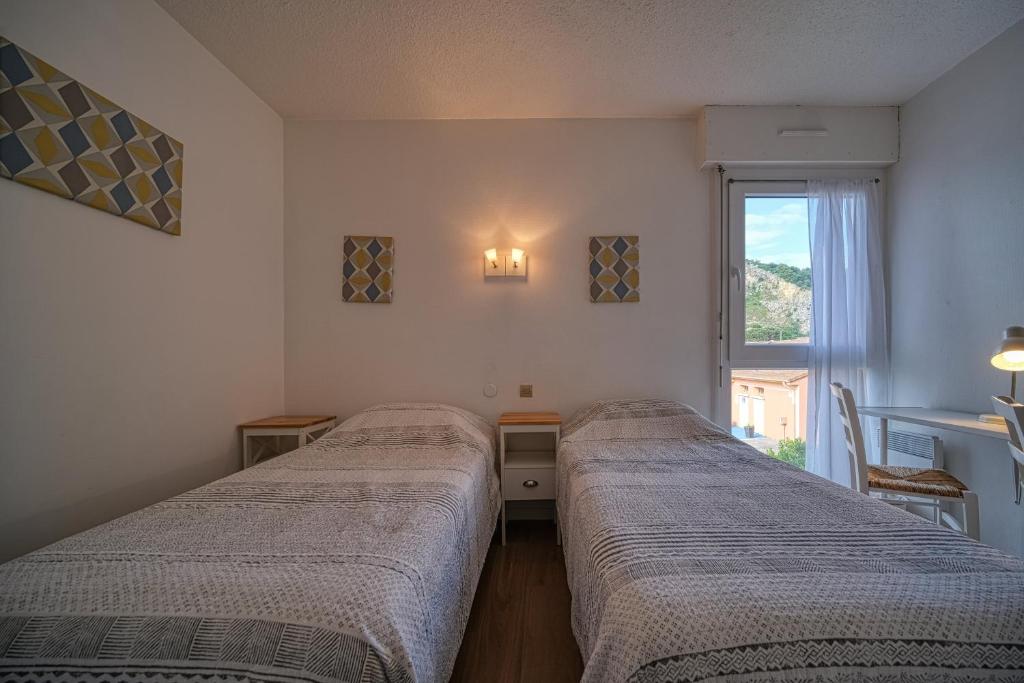 Postel nebo postele na pokoji v ubytování Hotel Coté Sud