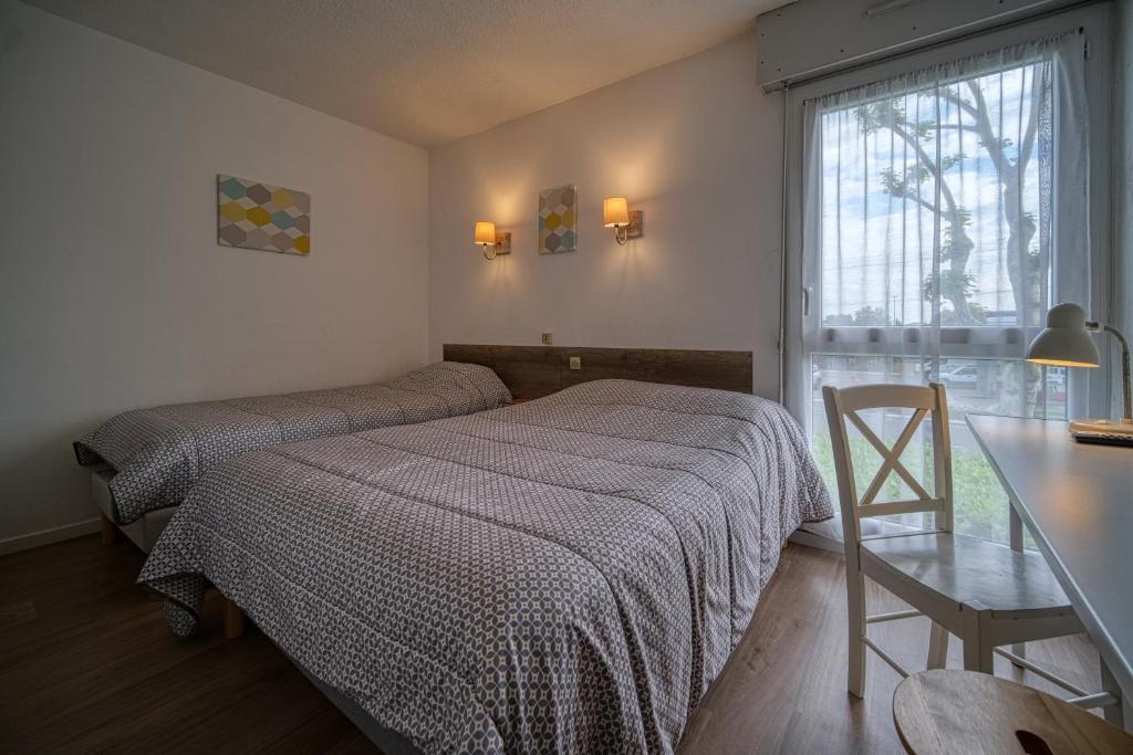 Postel nebo postele na pokoji v ubytování Hotel Coté Sud