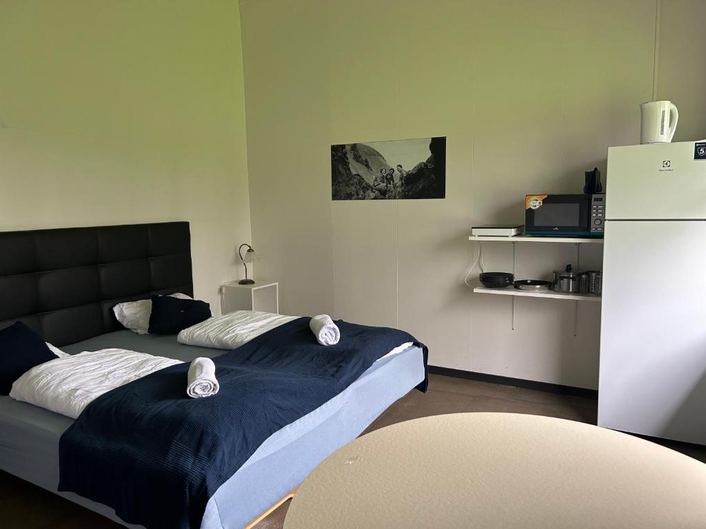 Letto o letti in una camera di Arhus Cottage and Camping
