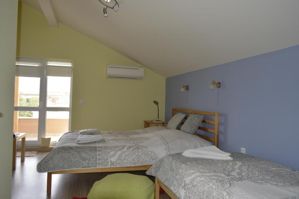 Postel nebo postele na pokoji v ubytování Albatros Comfort like home
