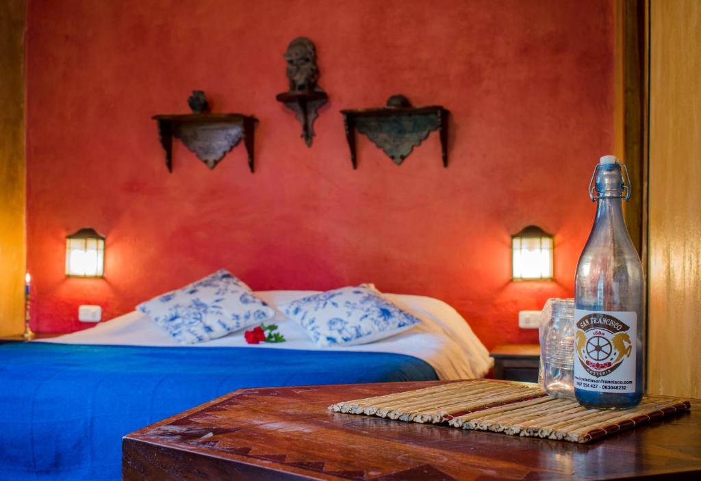 Postel nebo postele na pokoji v ubytování Hacienda San Francisco