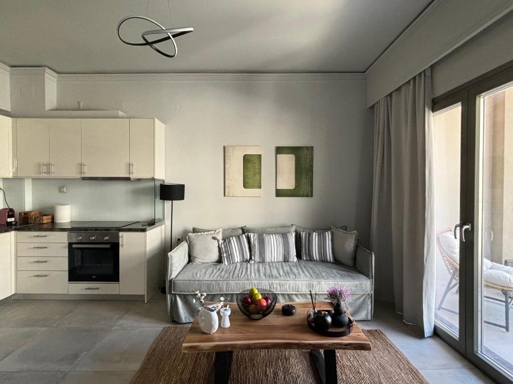 a bedroom with a bed and a table with fruit on it at Flats 5-11 apts in Heraklio